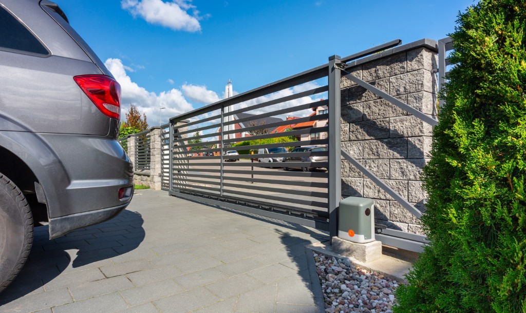 ParkPro team testing newly installed automatic gate and safety sensors in Arizona community